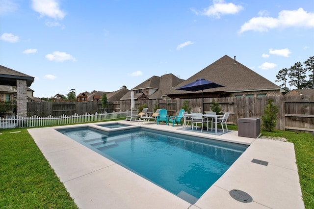 2824 Jehlon Ln, Conroe, TX 77385 - view of swimming pool with a patio area, a pool with connected hot tub, and a residential view