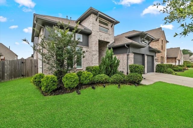 2824 Jehlon Ln, Conroe, TX 77385 - view of front of home with driveway, brick siding, a garage, and a shingled roof