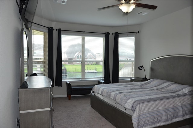 bedroom featuring carpet floors, a ceiling fan, and baseboards