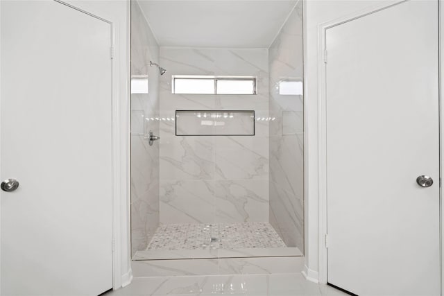 6719 Brittany Park Ln, Houston, TX 77066 - bathroom featuring a shower stall and marble look tile flooring