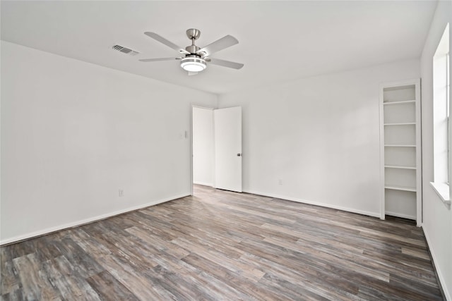 6719 Brittany Park Ln, Houston, TX 77066 - spare room featuring ceiling fan, wood finished floors, and baseboards