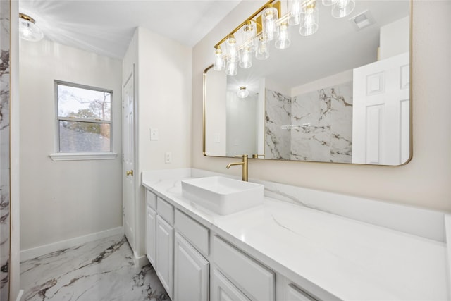 1910 Shark Ct, Crosby, TX 77532 - full bath with marble look tile flooring, vanity, and baseboards