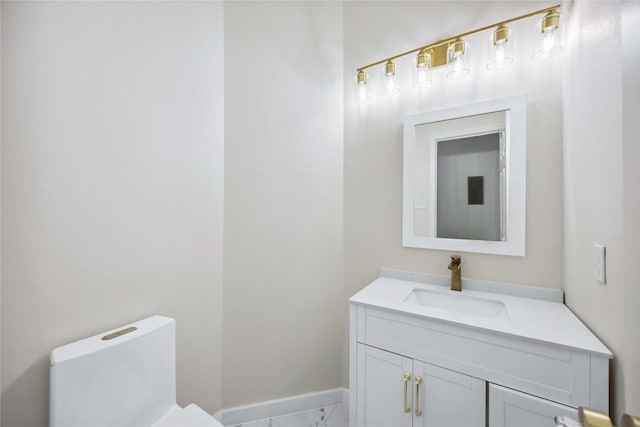 1910 Shark Ct, Crosby, TX 77532 - bathroom featuring marble look tile flooring, vanity, toilet, and baseboards