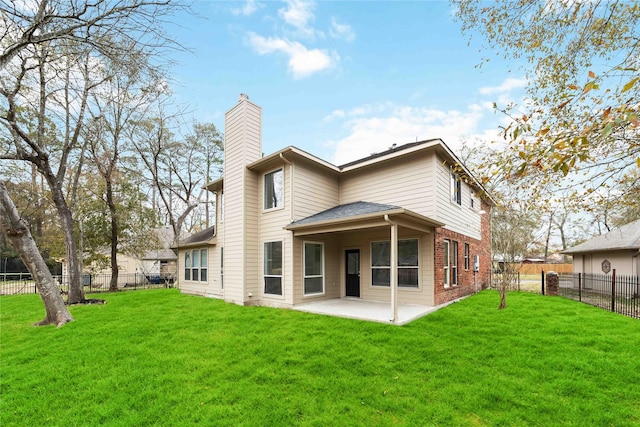 1910 Shark Ct, Crosby, TX 77532 - rear view of house with a chimney, a patio, and brick siding