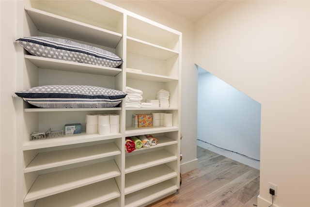 1311 Oahu Dr, Tiki Island, TX 77554 - walk in closet with wood finished floors