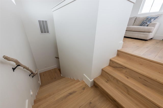1311 Oahu Dr, Tiki Island, TX 77554 - stairs with wood finished floors