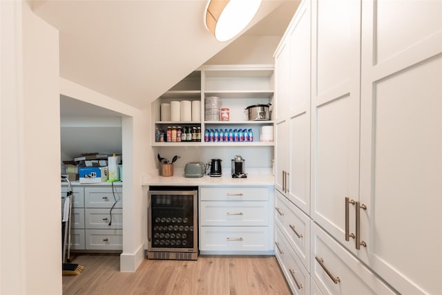 1311 Oahu Dr, Tiki Island, TX 77554 - indoor dry bar featuring wine cooler and light wood finished floors