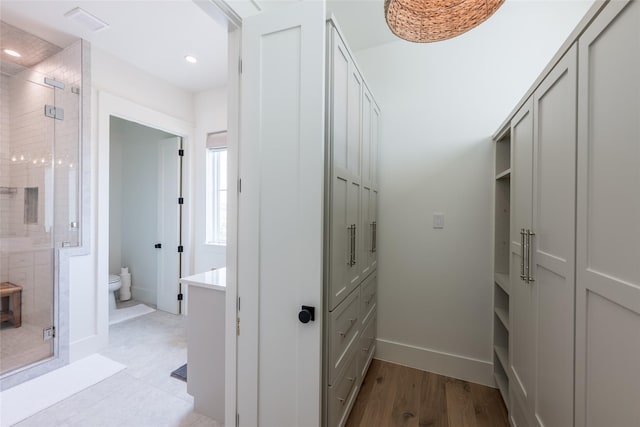 1311 Oahu Dr, Tiki Island, TX 77554 - hallway with recessed lighting, baseboards, and light wood-style flooring