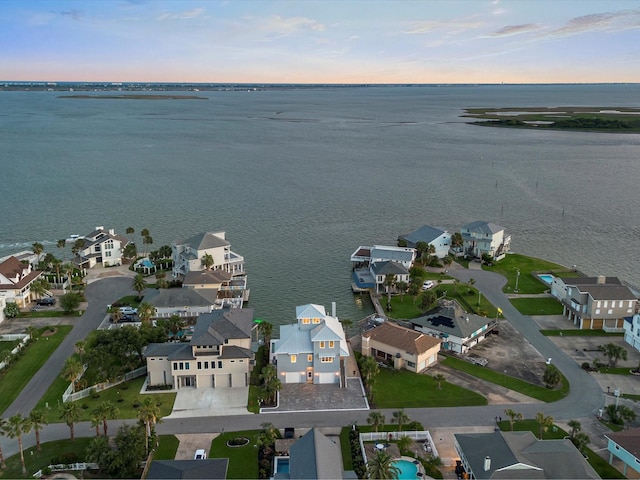 1311 Oahu Dr, Tiki Island, TX 77554 - aerial view at dusk of a water view and a residential view