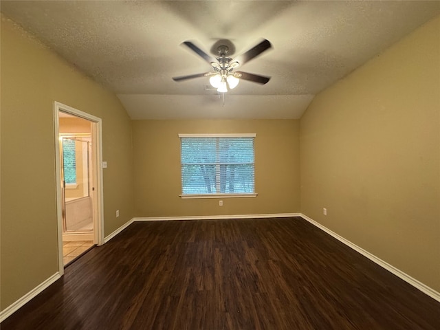118 N Camellia Grove Cir, The Woodlands, TX 77382 - unfurnished room with dark wood finished floors, a ceiling fan, vaulted ceiling, a textured ceiling, and baseboards