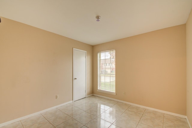 9470 Gulf Bridge St, Houston, TX 77075 - unfurnished room with baseboards and light tile patterned floors