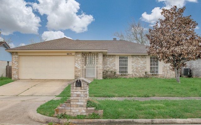 9470 Gulf Bridge St, Houston, TX 77075 - ranch-style home with concrete driveway, a garage, a front yard, and a shingled roof
