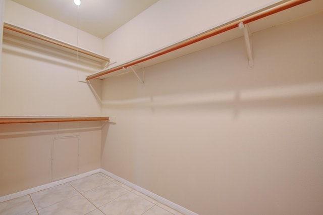 9470 Gulf Bridge St, Houston, TX 77075 - walk in closet featuring light tile patterned floors