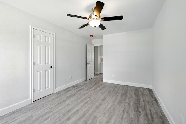 5614 Northridge Dr, Houston, TX 77033 - unfurnished bedroom with wood finished floors, baseboards, and ceiling fan