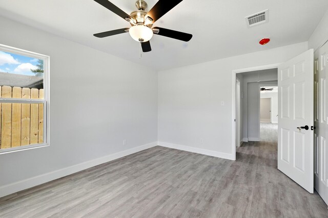 5614 Northridge Dr, Houston, TX 77033 - unfurnished bedroom featuring light wood-type flooring, baseboards, and ceiling fan