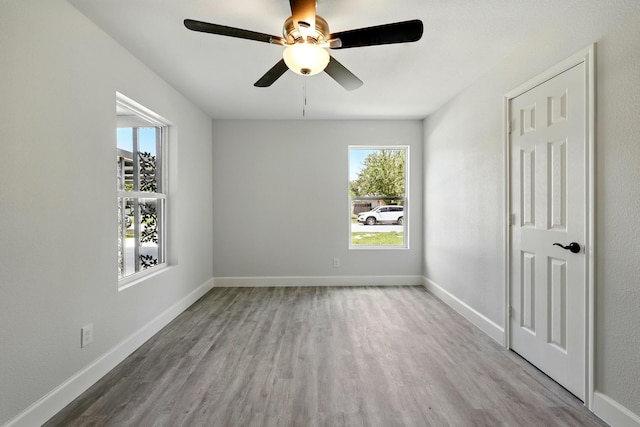 5614 Northridge Dr, Houston, TX 77033 - spare room with healthy amount of natural light, wood finished floors, ceiling fan, and baseboards