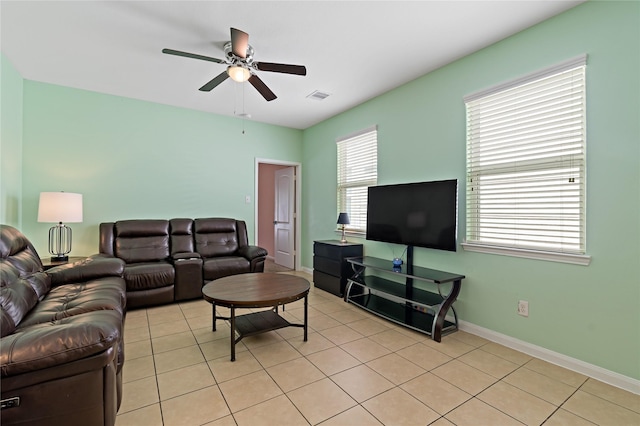 11020 Panther Ct, Houston, TX 77099 - living room with ceiling fan, light tile patterned floors, and baseboards