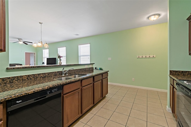 11020 Panther Ct, Houston, TX 77099 - kitchen with black appliances, a sink, dark stone countertops, decorative light fixtures, and light tile patterned floors