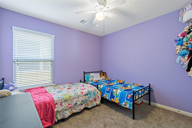 11020 Panther Ct, Houston, TX 77099 - carpeted bedroom with multiple windows, a ceiling fan, and baseboards