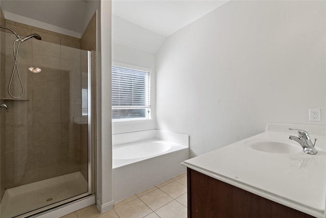11020 Panther Ct, Houston, TX 77099 - bathroom with a shower stall, tile patterned floors, a bath, vaulted ceiling, and vanity