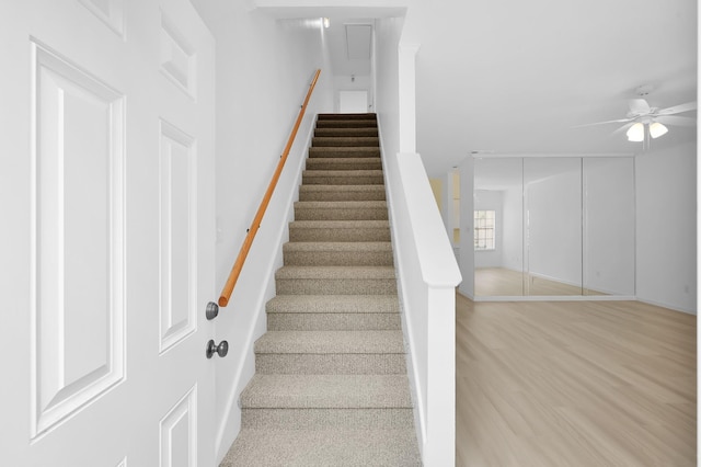 9850 Pagewood Ln Unit 1208, Houston, TX 77042 - stairway with ceiling fan, wood finished floors, and baseboards