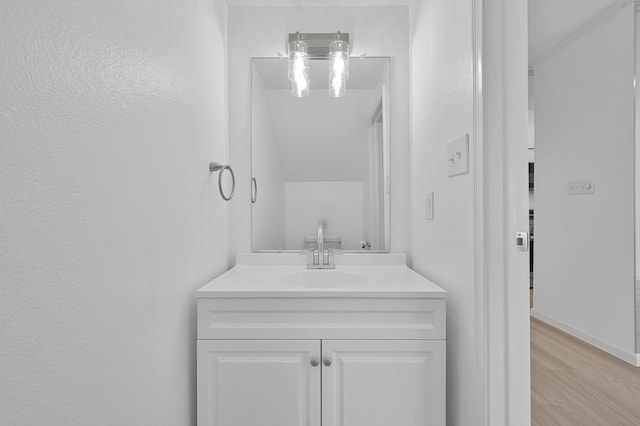 9850 Pagewood Ln Unit 1208, Houston, TX 77042 - bathroom with vanity and wood finished floors