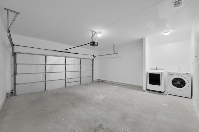 9850 Pagewood Ln Unit 1208, Houston, TX 77042 - garage with a garage door opener and washer and dryer