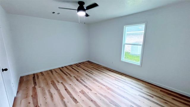 14406 Roundstone Ln, Houston, TX 77015 - unfurnished room with ceiling fan, light wood-style floors, and baseboards
