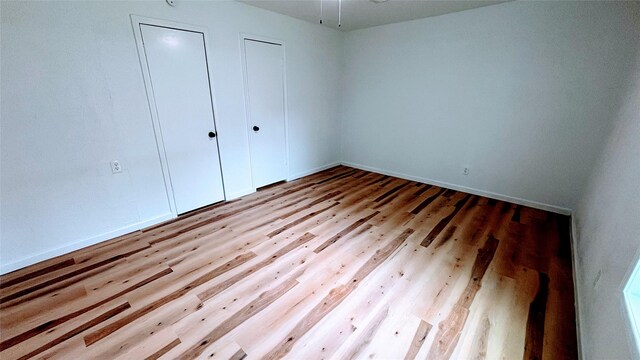 14406 Roundstone Ln, Houston, TX 77015 - unfurnished bedroom featuring wood finished floors and baseboards