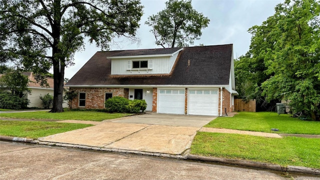 14406 Roundstone Ln, Houston, TX 77015 - view of front of house with concrete driveway, brick siding, and a garage