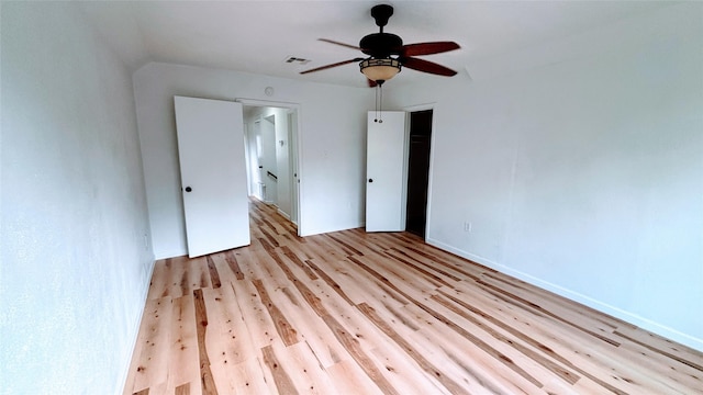 14406 Roundstone Ln, Houston, TX 77015 - unfurnished bedroom featuring light wood-type flooring, a ceiling fan, and baseboards