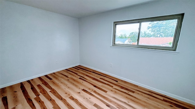 14406 Roundstone Ln, Houston, TX 77015 - empty room with baseboards and light wood-style floors