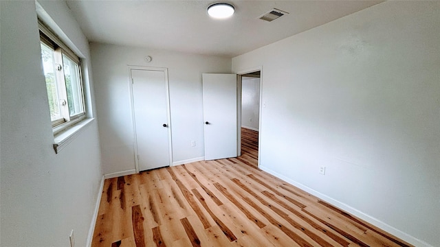 14406 Roundstone Ln, Houston, TX 77015 - unfurnished bedroom featuring light wood-style floors and baseboards