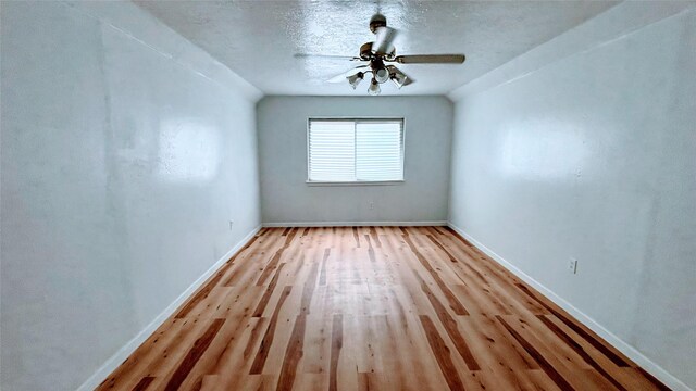 14406 Roundstone Ln, Houston, TX 77015 - spare room with wood finished floors, baseboards, and ceiling fan