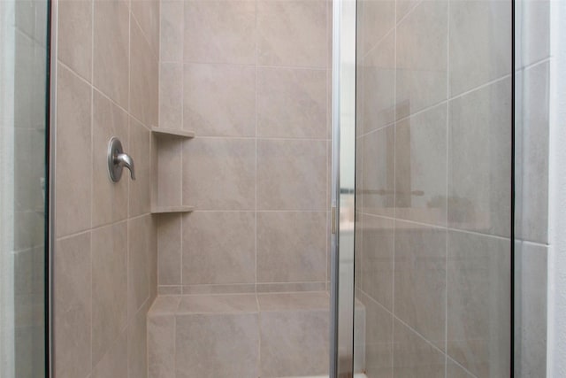 full bath with a shower stall