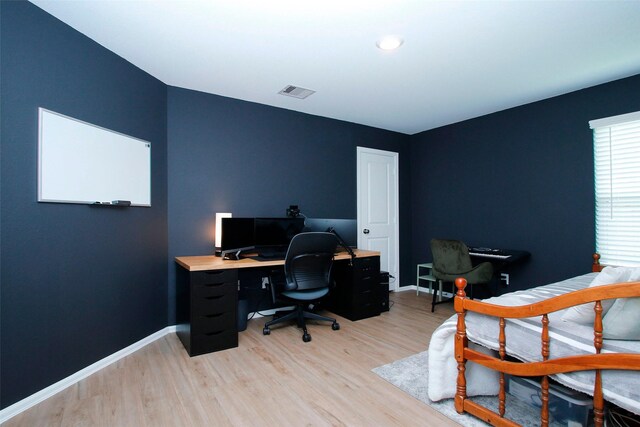 office featuring light wood-type flooring and baseboards