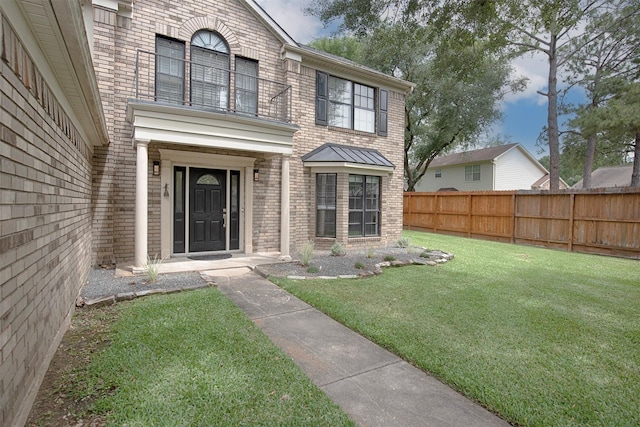 2030 Cutter Dr, League City, TX 77573 - doorway to property with brick siding and a balcony