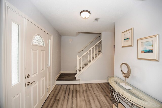2030 Cutter Dr, League City, TX 77573 - entryway with wood finished floors, stairs, and baseboards
