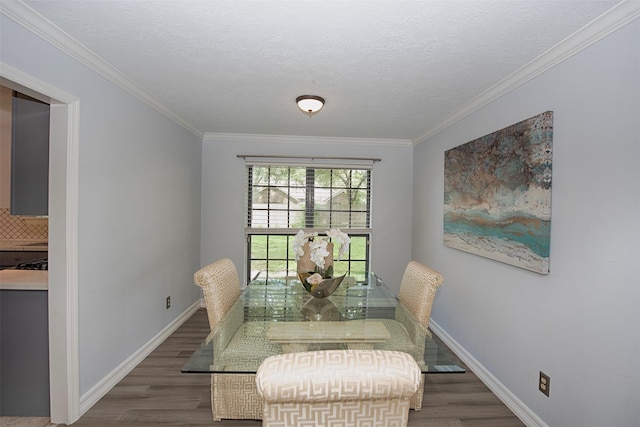2030 Cutter Dr, League City, TX 77573 - dining area with wood finished floors, baseboards, and ornamental molding