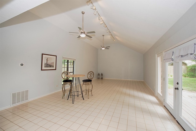 2030 Cutter Dr, League City, TX 77573 - dining space featuring vaulted ceiling, baseboards, ceiling fan, rail lighting, and light tile patterned floors