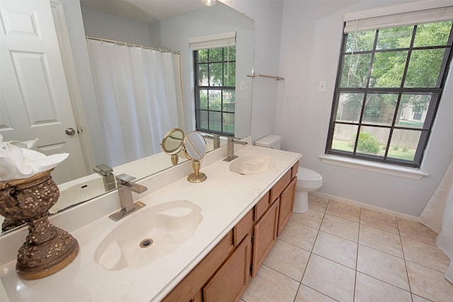 2030 Cutter Dr, League City, TX 77573 - bathroom with toilet, tile patterned floors, double vanity, baseboards, and a shower with curtain