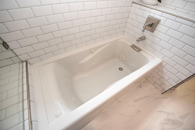 2030 Cutter Dr, League City, TX 77573 - bathroom with marble finish flooring, a jetted tub, and tile walls