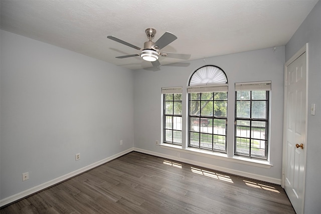 2030 Cutter Dr, League City, TX 77573 - unfurnished room with dark wood finished floors, baseboards, and ceiling fan