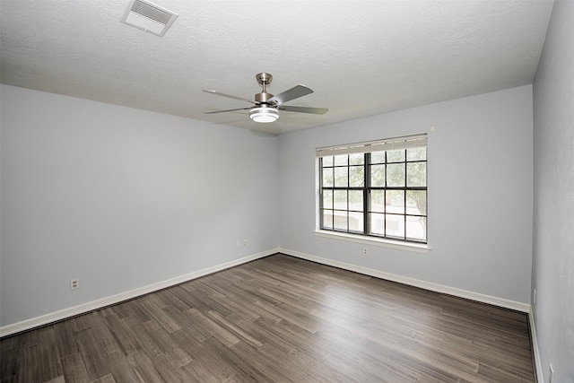 2030 Cutter Dr, League City, TX 77573 - spare room with ceiling fan, dark wood-type flooring, baseboards, and a textured ceiling