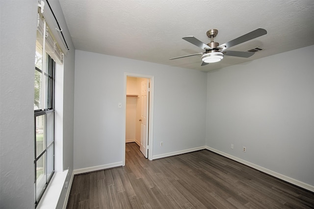 2030 Cutter Dr, League City, TX 77573 - empty room featuring wood finished floors, a ceiling fan, baseboards, and a textured ceiling
