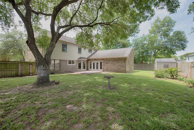 2030 Cutter Dr, League City, TX 77573 - rear view of house featuring french doors, brick siding, a storage shed, and an outdoor structure