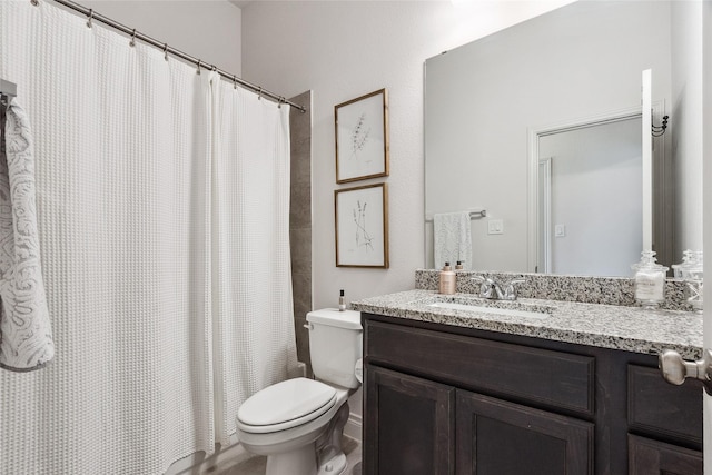 bathroom with toilet, vanity, and a shower with shower curtain
