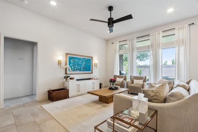 living area featuring ceiling fan, recessed lighting, and baseboards