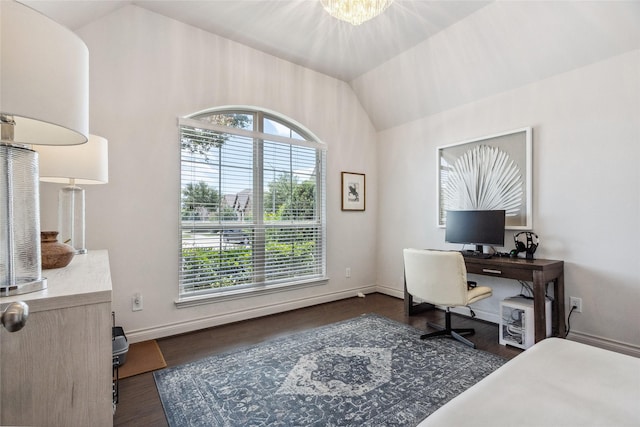 office area featuring plenty of natural light, wood finished floors, vaulted ceiling, and baseboards