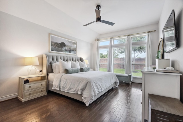 bedroom with dark wood-style flooring, lofted ceiling, a ceiling fan, and baseboards